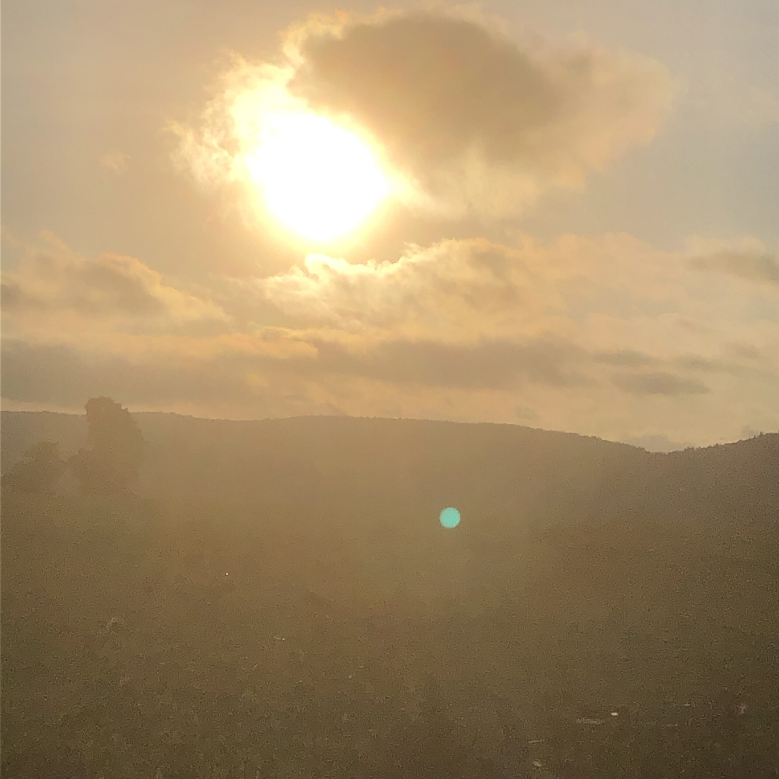 sun and clouds and mountains in Vermont